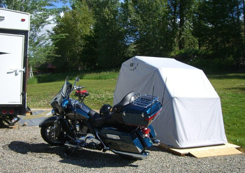 Ride in motorcycle cover on platform bike barn