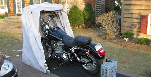 bike barn standard model used as a dust cover held up in heavy wind